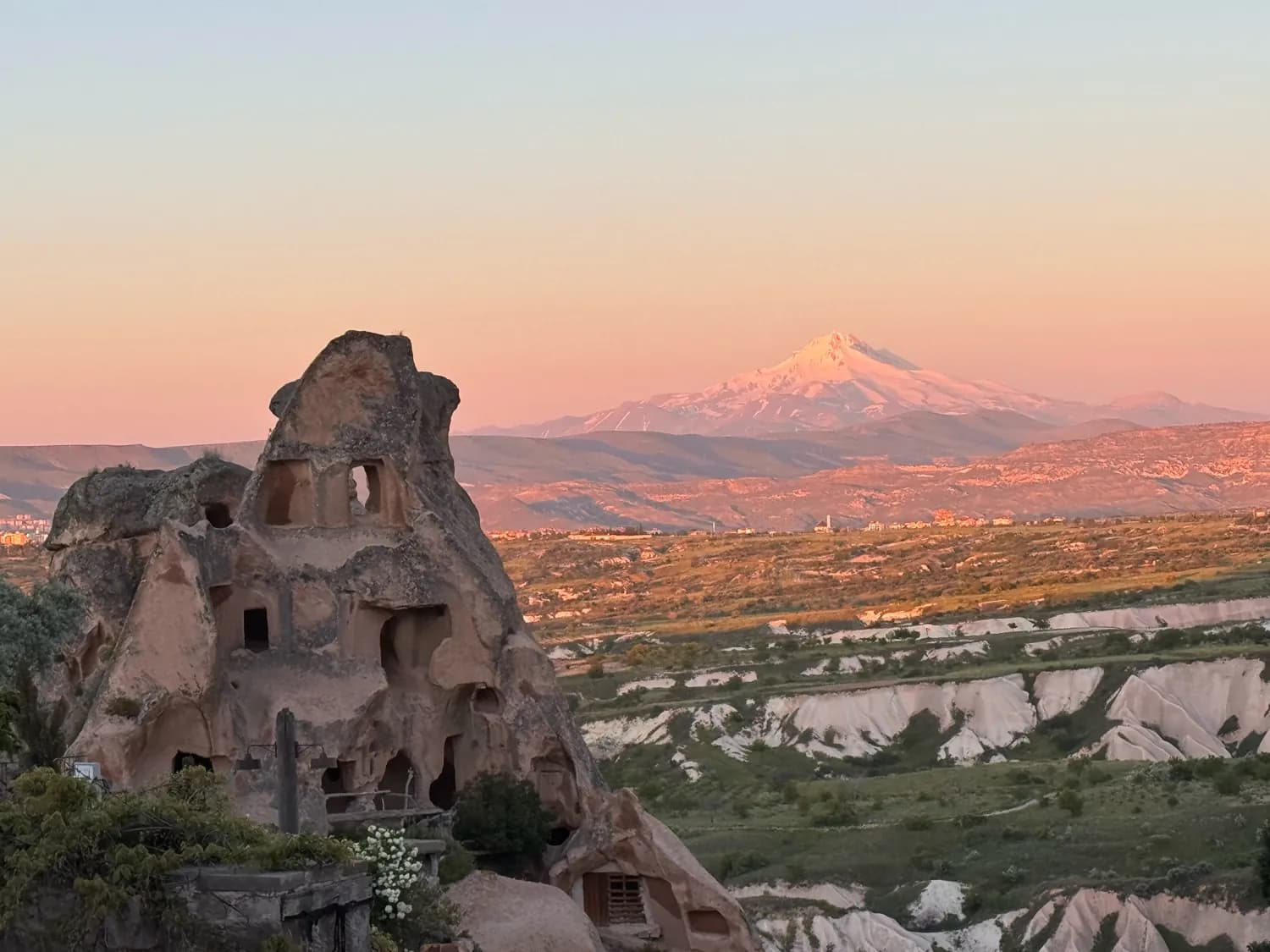 Cappadocia cave dwellings and Mount Erciyes at sunset - Turkey Tours